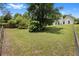 Fenced-in backyard featuring lots of grass and lush trees at 3357 Saddleton Way, Douglasville, GA 30134