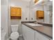 Bathroom features a single sink vanity with tile flooring and a shower with tub at 3357 Saddleton Way, Douglasville, GA 30134