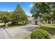 A lovely home with yellow siding, a large driveway, and mature trees offering shade at 3357 Saddleton Way, Douglasville, GA 30134