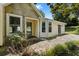 Inviting home with stone facade, a covered entryway, and well-maintained landscaping at 3357 Saddleton Way, Douglasville, GA 30134