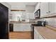 Well-equipped kitchen with sleek, black appliances, ample counter space, and modern lighting for efficient meal preparation at 3357 Saddleton Way, Douglasville, GA 30134