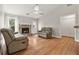 Spacious living room with a cozy fireplace and neutral color palette, creating a comfortable, welcoming space at 3357 Saddleton Way, Douglasville, GA 30134