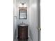 Cozy half bath with decorative sink and dark wood vanity at 412 Mcafee Nw Ct # 14, Kennesaw, GA 30144
