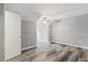 Spacious bedroom with wood-look flooring, ceiling fan, and neutral paint at 412 Mcafee Nw Ct # 14, Kennesaw, GA 30144