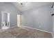 Spacious bedroom with neutral carpet and a ceiling fan at 412 Mcafee Nw Ct # 14, Kennesaw, GA 30144