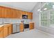 Charming kitchen with stainless steel appliances, tile floors and plenty of natural light at 412 Mcafee Nw Ct # 14, Kennesaw, GA 30144