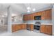 Modern kitchen with stainless steel appliances, ample counter space, and stylish lighting fixtures at 412 Mcafee Nw Ct # 14, Kennesaw, GA 30144