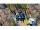 An aerial shot highlights the location of the home in a tranquil, wooded neighborhood at 4990 Sawgrass Nw Pl, Acworth, GA 30102