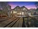 Exterior shot of the back of the home at dusk at 4990 Sawgrass Nw Pl, Acworth, GA 30102