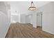 Spacious basement featuring laminate floors, light fixtures and white walls at 4990 Sawgrass Nw Pl, Acworth, GA 30102