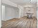 Open-concept basement with laminate floors, a breakfast bar and light fixtures at 4990 Sawgrass Nw Pl, Acworth, GA 30102