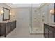 Elegant bathroom featuring a glass-enclosed shower and a vanity with a granite countertop at 4990 Sawgrass Nw Pl, Acworth, GA 30102