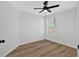 Cozy bedroom featuring laminate floors, a window, and a ceiling fan at 4990 Sawgrass Nw Pl, Acworth, GA 30102