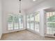 Bright dining area with large windows that let in natural light and door leading to the outside at 4990 Sawgrass Nw Pl, Acworth, GA 30102