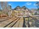 Spacious home featuring an open patio, complemented by a lush yard and mature trees at 4990 Sawgrass Nw Pl, Acworth, GA 30102