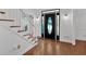 Elegant foyer with hardwood floors and decorative front door at 4990 Sawgrass Nw Pl, Acworth, GA 30102