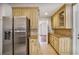 Kitchen featuring stainless steel refrigerator, granite countertops, and plenty of cabinet storage at 4990 Sawgrass Nw Pl, Acworth, GA 30102