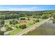 Aerial view shows baseball fields near a lake and a road; trees and buildings in background at 1703 W Nancy Creek Ne Dr, Brookhaven, GA 30319