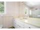 Bathroom with neutral walls, wallpaper, vanity with cabinets, and shower at 1703 W Nancy Creek Ne Dr, Brookhaven, GA 30319