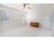 Bedroom with carpet, two windows, neutral walls, ceiling fan and closet doors at 1703 W Nancy Creek Ne Dr, Brookhaven, GA 30319