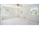 Bright bedroom with neutral walls, white trim, carpet, and 3 large windows at 1703 W Nancy Creek Ne Dr, Brookhaven, GA 30319