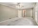 Bright bedroom featuring neutral walls, trim, carpet, ceiling fan and natural light at 1703 W Nancy Creek Ne Dr, Brookhaven, GA 30319