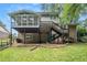 Charming two-story home exterior with a large deck, brick siding, and a well-maintained backyard at 1703 W Nancy Creek Ne Dr, Brookhaven, GA 30319