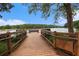 Lake overlook features a wooden pier with bench, views of the lake and tree lined horizon at 1703 W Nancy Creek Ne Dr, Brookhaven, GA 30319