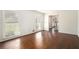 Bright living room featuring hardwood floors and sunlit windows, leading to an inviting entryway at 1703 W Nancy Creek Ne Dr, Brookhaven, GA 30319