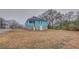 View of the back of the home with backyard and street in the background at 1730 Spring Ne St, Conyers, GA 30012
