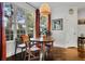 This bright dining area features large windows and orange curtains at 2295 Hemrick Rd, Cumming, GA 30041