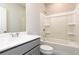 Bright bathroom featuring a white vanity, tub, and modern fixtures at 2971 Beaconwood Ct, Lawrenceville, GA 30043
