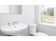 Powder room with white pedestal sink at 2971 Beaconwood Ct, Lawrenceville, GA 30043