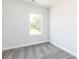 Well-lit bedroom with neutral paint and plush gray carpet flooring at 2971 Beaconwood Ct, Lawrenceville, GA 30043