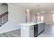 Kitchen island with sink, dishwasher, and wood-look floors, is highly functional at 2971 Beaconwood Ct, Lawrenceville, GA 30043