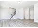 Cozy living room featuring light gray walls, light wood floors, two closets, and a stairwell at 2971 Beaconwood Ct, Lawrenceville, GA 30043