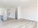 Bright living room with wood-look flooring and neutral paint is move-in ready at 2971 Beaconwood Ct, Lawrenceville, GA 30043