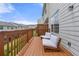 Relaxing back deck featuring wooden rails and patio furniture overlooking green space at 3542 Chattahoochee Summit Se Ln, Atlanta, GA 30339