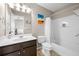 Bathroom featuring a tub and shower combination, and a dark vanity with storage at 3542 Chattahoochee Summit Se Ln, Atlanta, GA 30339