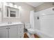 Bright bathroom featuring a white vanity, a modern mirror and a shower with bathtub at 3542 Chattahoochee Summit Se Ln, Atlanta, GA 30339