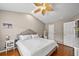 Bright bedroom featuring hardwood floors, a ceiling fan, and neutral paint at 3542 Chattahoochee Summit Se Ln, Atlanta, GA 30339