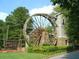 Community sign with watermill in natural setting at 3542 Chattahoochee Summit Se Ln, Atlanta, GA 30339