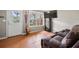 Cozy living room featuring a sofa, TV, and lots of natural light at 3542 Chattahoochee Summit Se Ln, Atlanta, GA 30339