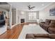 Comfortable living room with fireplace, hardwood floors, and natural lighting at 3542 Chattahoochee Summit Se Ln, Atlanta, GA 30339