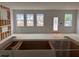 Bright, unfinished living room with natural light from multiple windows; awaiting your personal touch at 3104 Marbella Cir # 2, Kennesaw, GA 30152