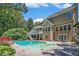 Exterior of home with a pool, deck, and multiple windows offering natural light at 3774 Seasons Nw Dr, Acworth, GA 30101