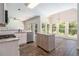 Modern kitchen with stainless steel appliances, an island, and lots of natural light at 3774 Seasons Nw Dr, Acworth, GA 30101