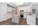 Contemporary kitchen with white cabinetry, an island, stainless appliances, and ample counter space at 3774 Seasons Nw Dr, Acworth, GA 30101