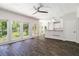 Bright, open-concept living space featuring dark LVP flooring, and access to outdoor living at 3774 Seasons Nw Dr, Acworth, GA 30101