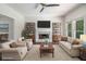 Bright living room featuring a fireplace, ceiling fan, and lots of natural light at 3774 Seasons Nw Dr, Acworth, GA 30101